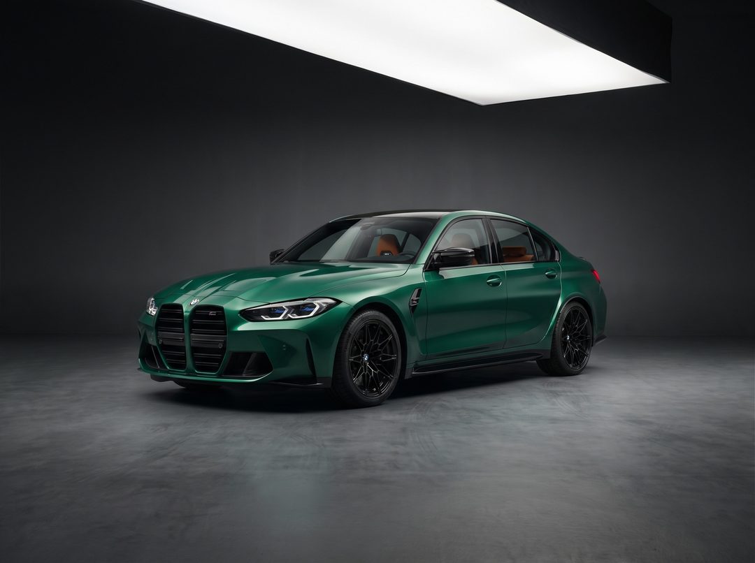 Green BMW M3 Competition sedan, low front three-quarter
