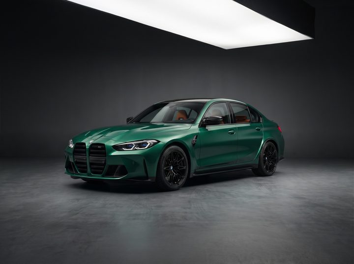 Green BMW M3 Competition sedan, low front three-quarter